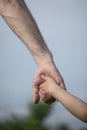 Father`s hand lead his child in summer nature outdoor, trust family concept. Fathers day concept Royalty Free Stock Photo