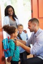Father Saying Goodbye To Children As They Leave For School Royalty Free Stock Photo