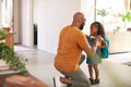 Father Saying Goodbye To Daughter As She Leaves Home For School Royalty Free Stock Photo