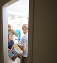 Father shaving and doughter watching