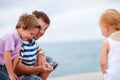 Father showing caught fish to kids Royalty Free Stock Photo