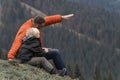 Father showing his son something on the top of the mountain. Weekend hike in mountains. Hiking with children Royalty Free Stock Photo