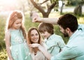 Father shows his family a caterpillar Royalty Free Stock Photo