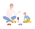 Father Sitting on the Floor with Crossed Legs and Playing Toy Cars with Her Son, Parent and Kid Spending Time Together