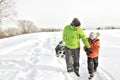 A cool Father drag his boy in sled