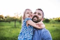 Father with a small daughter having fun in spring nature, taking selfie. Royalty Free Stock Photo