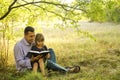 father with a small daughter reading the Bible Royalty Free Stock Photo