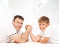 Father and son in an arm-wrestling competition Royalty Free Stock Photo