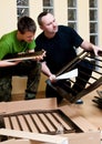 Father and son assemble crib Royalty Free Stock Photo