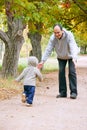 Father and son in autumn park Royalty Free Stock Photo