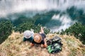 Father and son backpackers relax after long walk near the beautiful lake Royalty Free Stock Photo