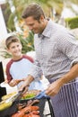 Father And Son Barbequing