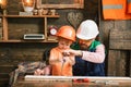 Father and son boy repairing in workshop. Child with carpenter tools in woodwork. Royalty Free Stock Photo