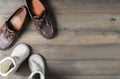 Father and son brown leather boots shoes on wooden