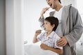 Father And Son Brushing Teeth Royalty Free Stock Photo