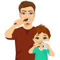 Father and son brushing teeth Royalty Free Stock Photo