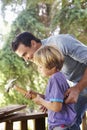 Father And Son Building Tree House Together Royalty Free Stock Photo