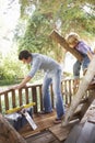 Father And Son Building Tree House Together Royalty Free Stock Photo