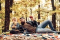 Father and son camping. Man with beard, dad with young son in autumn park. Happy joyful father with a cute son vacation