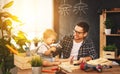 Father and son carved of wood in carpentry workshop Royalty Free Stock Photo