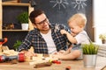 Father and son carved of wood in carpentry workshop Royalty Free Stock Photo