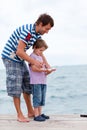 Father and son caught fish Royalty Free Stock Photo