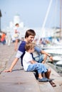 Father and son in city harbor