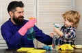Father and son cleaning. Child little helper. Royalty Free Stock Photo