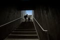 Father and son climbing stairs in pedestrian subway Royalty Free Stock Photo