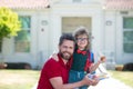 Father and son come back from school. Little schoolboy eating tasty lunch outdoors. Royalty Free Stock Photo