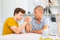 Father and son competing in arm wrestling Royalty Free Stock Photo