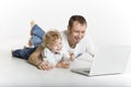 Father and son are on computer on the floor