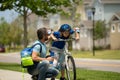 Father and son concept. Father teaching son in protective helmet riding bike. Father helping son to ride a bicycle Royalty Free Stock Photo