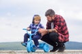 Father and son cycling with kids bike outdoor. cute Little boy learn to ride a bike with his daddy. Dad teaching son to Royalty Free Stock Photo