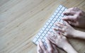 Father and son or daughter using the computer keyboard together Royalty Free Stock Photo