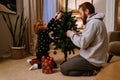 Father and son decorating Christmas tree in living room Royalty Free Stock Photo