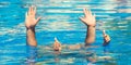 Father and son dives under the water in the pool at summer day. Leisure and swimming at holidays.