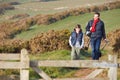 Father And Son With Dog Walking Along Coastal Path Royalty Free Stock Photo