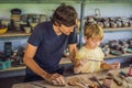 Father and son doing ceramic pot in pottery workshop Royalty Free Stock Photo