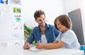 Father and son doing homework together Royalty Free Stock Photo