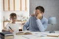 Father and son are doing homework together. Home schooling. Teen boy studying at home. Dad and schoolboy doing homework Royalty Free Stock Photo