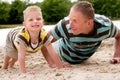 Father and son doing push-ups Royalty Free Stock Photo