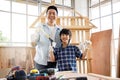Father and son doing woodwork together. Royalty Free Stock Photo