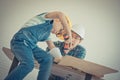 Father and son drilling wood on workshop table for home improvement, for family bonding father and son love concept Royalty Free Stock Photo