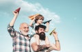 Father and son enjoying outdoor. Father and son playing outdoors. Happy men loving family. Happy grandfather father and Royalty Free Stock Photo