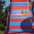 Father and son enjoying the ride down at aquapark Royalty Free Stock Photo