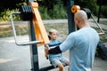 Father and son on exercise machine, sport training Royalty Free Stock Photo