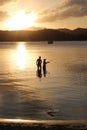 Father and son family fishing at sunset Royalty Free Stock Photo