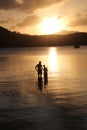 Father and son family fishing at sunset Royalty Free Stock Photo