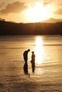 Father and son family fishing at sunset Royalty Free Stock Photo